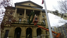 Hanging a large holiday wreath on a public building with a crane 6