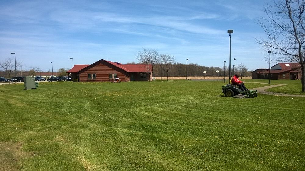 Someone mowing a lawn